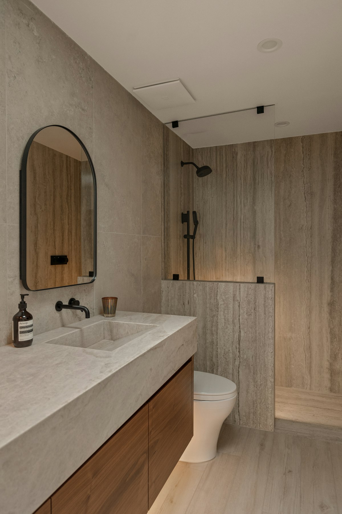 Stone-look bathroom tiles, shower and timber vanity