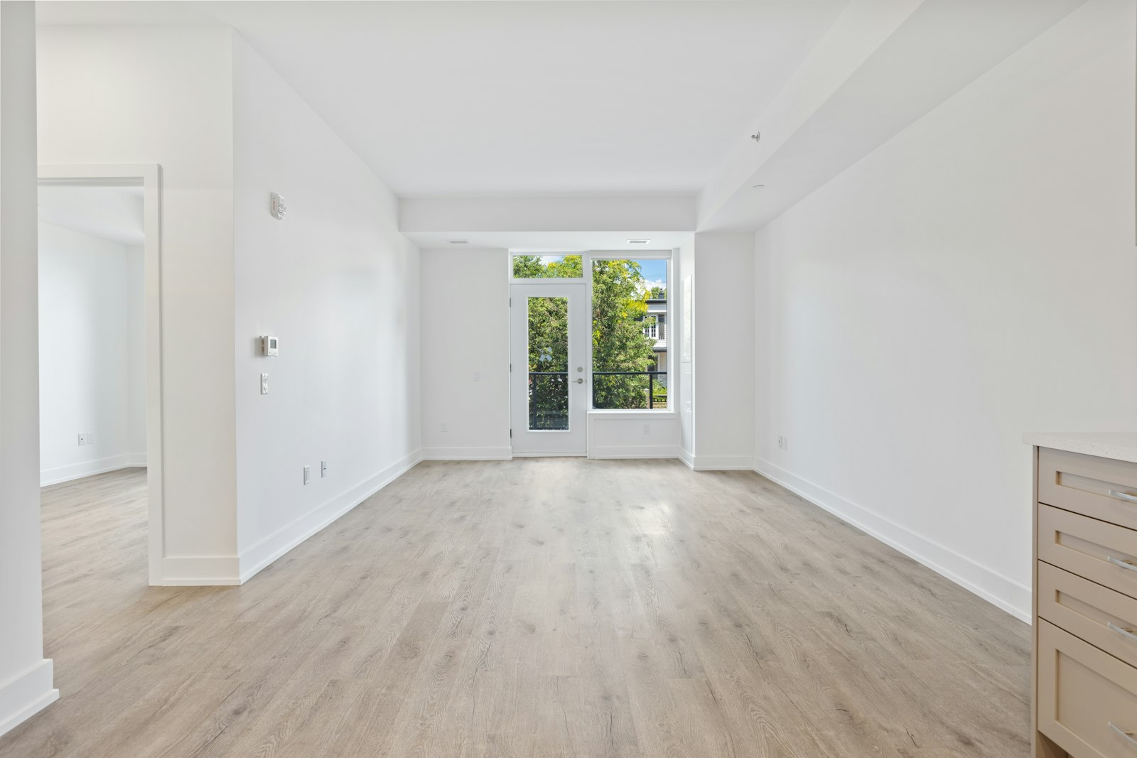 Bright living space with painted walls and an interior door