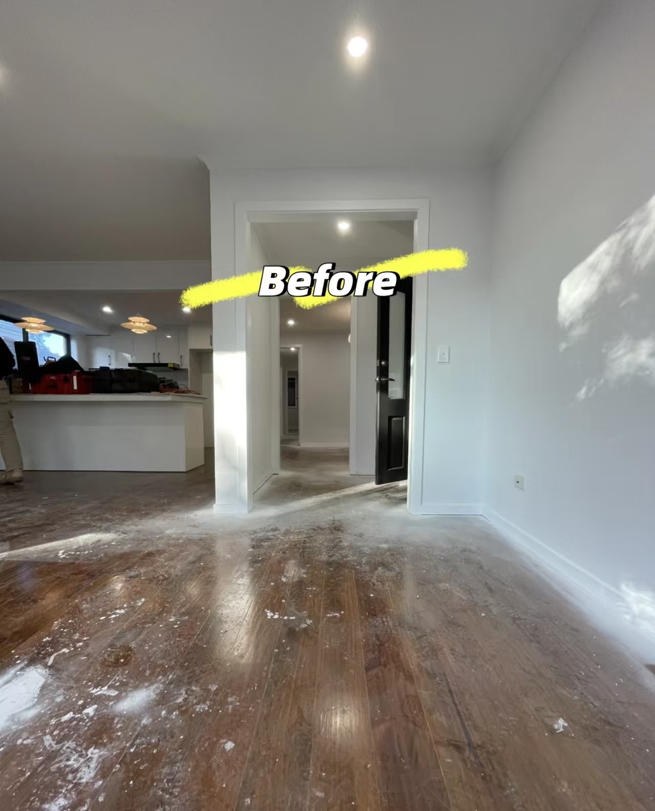 Worn dark timber floor in a living area before work